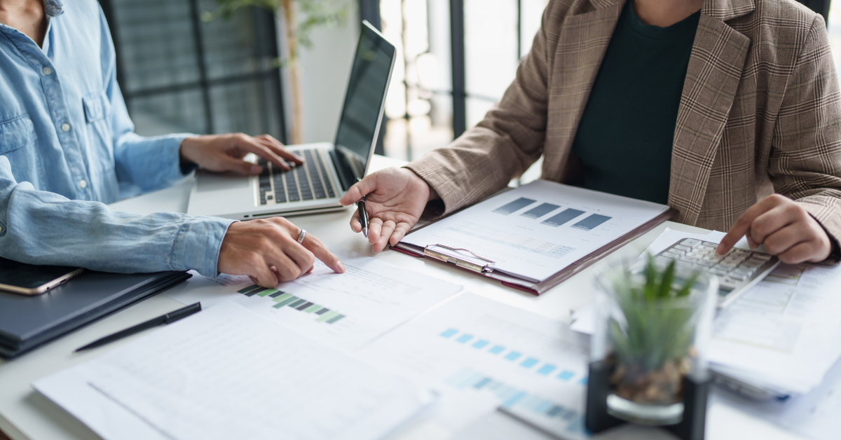 business people looking over internal theft reports